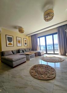 a living room with a couch and a table at B15/87/51 · Madinaty B15 Brand new 3BR Apt in Madinaty