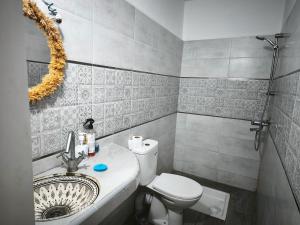 a bathroom with a sink and a toilet at Dar fatima in Essaouira +11 photos