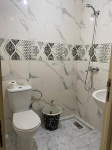 a bathroom with a toilet and a sink at Villa zaytoun in Agadir +19 photos