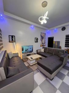 TV a/nebo společenská místnost v ubytování Gp house Fidjrossè plage