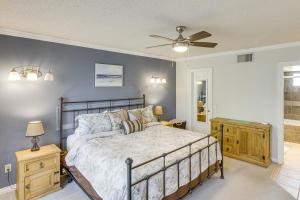 a bedroom with a bed and a ceiling fan at Golf and Swim Country Club Condo in Palm Desert in Palm Desert +22 photos
