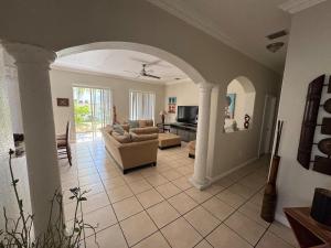 a living room with a couch and a table at The Garden House in Miami Lakes in Miami Lakes