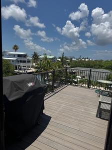 a black car parked on a wooden deck at Il Capitano - Little Torch Key in Little Torch Key