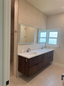 a bathroom with a sink and a mirror at Il Capitano - Little Torch Key in Little Torch Key