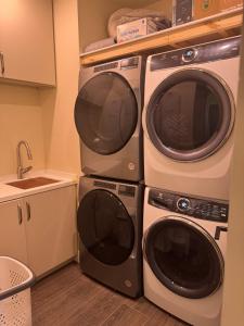 two microwaves stacked on top of each other in a kitchen at Il Capitano - Little Torch Key in Little Torch Key