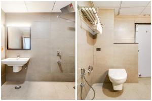a bathroom with a toilet and a sink at Super Townhouse Jashn in Lucknow