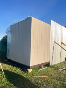 a large container is sitting next to a fence at Casa Acantilados Suites in Mar del Plata