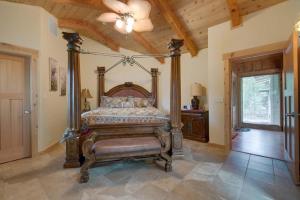a bedroom with a canopy bed and a ceiling at Seasons at McCall by Casago McCall - Donerightmanagement in McCall +59 photos