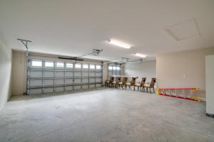 an empty room with a bunch of chairs in it at Golf and Swim in The Villages! Modern Home with Lanai in Wildwood +25 photos