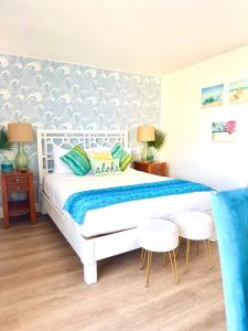 Postel nebo postele na pokoji v ubytování Sweet Blue Hawaii