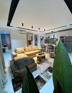 a living room with a couch and a table at Executive 2 bedroom apartment in Lagos