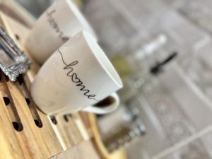 a coffee cup with the word forgiveness written on it at UrbanSoul Millau in Millau +9 photos