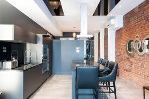 Kuchyň nebo kuchyňský kout v ubytování Boutique Lofts Milton Parc by Simplissimmo