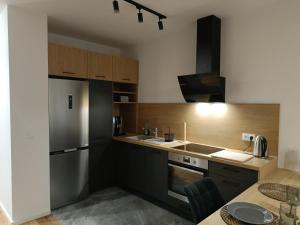 Η κουζίνα ή μικρή κουζίνα στο MODERNOVA Apartament Walendów Park +4 φωτογραφίες