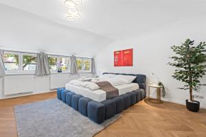 Postel nebo postele na pokoji v ubytování TEMPORA Homes - Luxury Villa Grinzing