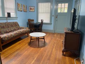 a living room with a couch and a table at Dog Friendly 1 bd 1 ba near Airport and Marta in Atlanta