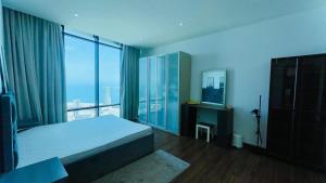 Ένα ή περισσότερα κρεβάτια σε δωμάτιο στο Cozy Apartment in Seef