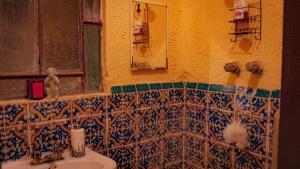 a bathroom with a sink and a mirror at céntrico guadalajara in Guadalajara +77 photos