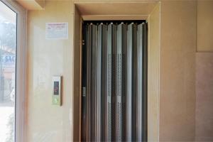 a metal radiator on the side of a building at Hotel O Blue Sagar in Puri