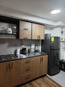 Kuchyň nebo kuchyňský kout v ubytování Apartamento cerca Terminal de Transportes y Cable aéreo + 10 fotografií