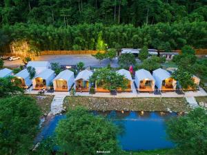 an aerial view of a resort with a pool at ชิลล์ แคมป์ ชะอม in Ban Bung Mai +65 photos