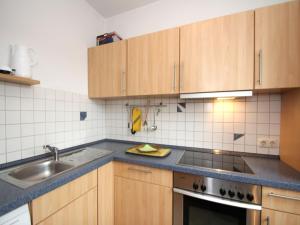 Kuchyň nebo kuchyňský kout v ubytování Bungalow, Dornumersiel