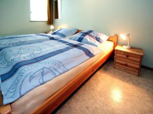 Postel nebo postele na pokoji v ubytování Bungalow, Dornumersiel