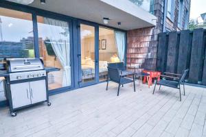 Kuchyň nebo kuchyňský kout v ubytování HOM I Depto con Gran Terraza con Vista al Lago