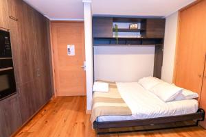 En eller flere senge i et værelse på HOM I Edif frente a la Costanera 1D1B 4 PAX