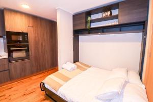 En eller flere senge i et værelse på HOM I Edif frente a la Costanera 1D1B 4 PAX