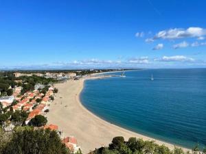 a view of a beach with houses and the ocean at Holiday Home in Stepnica near Szczecin Lagoon in Stepnica +12 photos