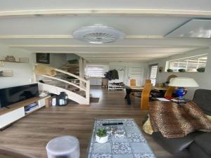 a living room with a couch and a table at Holiday Home in Stepnica near Szczecin Lagoon in Stepnica