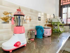 a pink and white blender sitting on a counter at Akee villa in Matara