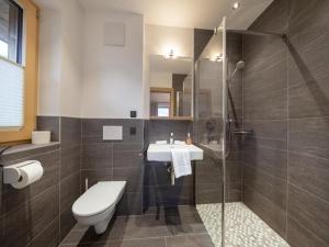 a bathroom with a toilet and a sink and a shower at Chalet in Neukirchen near Slopes in Neukirchen am Großvenediger +41 photos