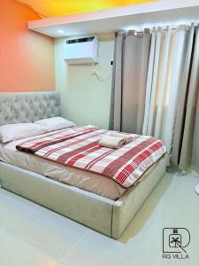 a bedroom with a bed in a room at RQ Pool Villa - 2 in Sampong