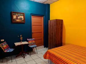 Postel nebo postele na pokoji v ubytování Expresión cultural restaurante y alojamiento