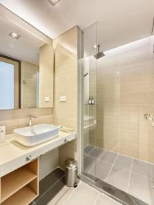a bathroom with a sink and a shower at The Pool Suite Premium Room-Jonker in Melaka