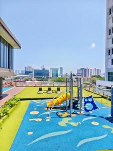 a playground with a slide on a roof at The Pool Suite Premium Room-Jonker in Melaka +32 photos