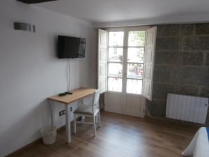 Telewizja i/lub zestaw kina domowego w obiekcie Pension Via-Stella