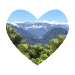 a heart shaped picture of a mountain valley with snow at Gasthof Dachsteinblick in Stainach