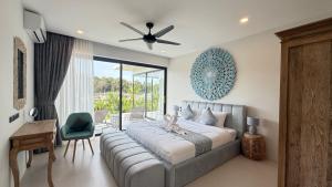 a bedroom with a large bed and a couch at Suan Serenity Villa in Koh Samui +57 photos