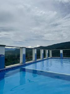 a large swimming pool on top of a building at Apartamento vacacional San Gil in San Gil