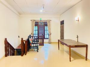 a living room with a table and a dining room at Dills Villa in Weligama +20 photos
