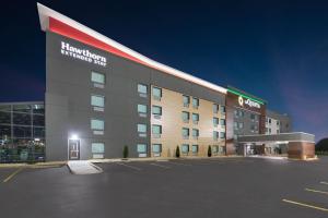 a hotel building with a parking lot in front of it at La Quinta by Wyndham Springdale in Springdale
