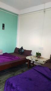 Ένα ή περισσότερα κρεβάτια σε δωμάτιο στο Neel DIGANTA HOME STAY, SILLERY GAON KALIMPONG