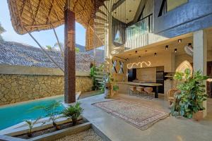 a house with a swimming pool and a patio at Happiness Kulambo Villa El Nido in El Nido
