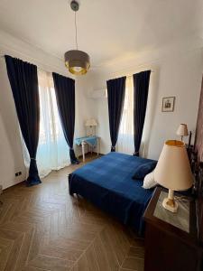 En eller flere senge i et værelse på Casa Lionessa