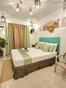 a bedroom with a large bed in a room at Siargao Alcove Verde Eco-Sanctuary Hostel in General Luna