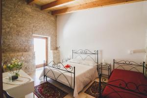 Postel nebo postele na pokoji v ubytování Ai Pilieri di Bagnoli