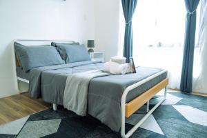 Ένα ή περισσότερα κρεβάτια σε δωμάτιο στο Ecoluxe Apartelle Davao